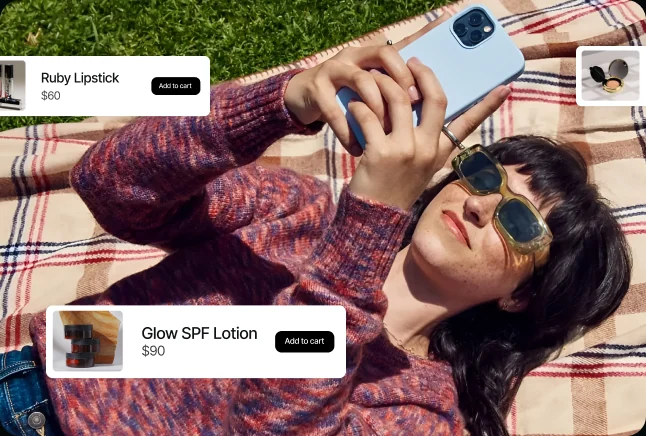 Shopper lying on a blanket browsing products on a phone